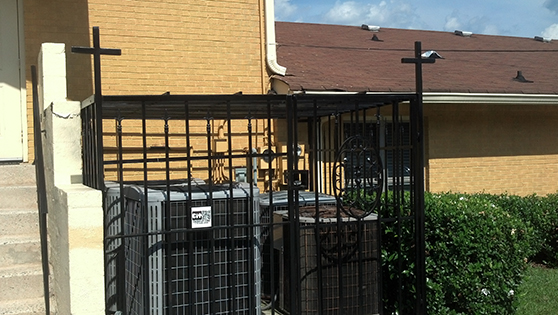 Church wrought iron fence air conditioner